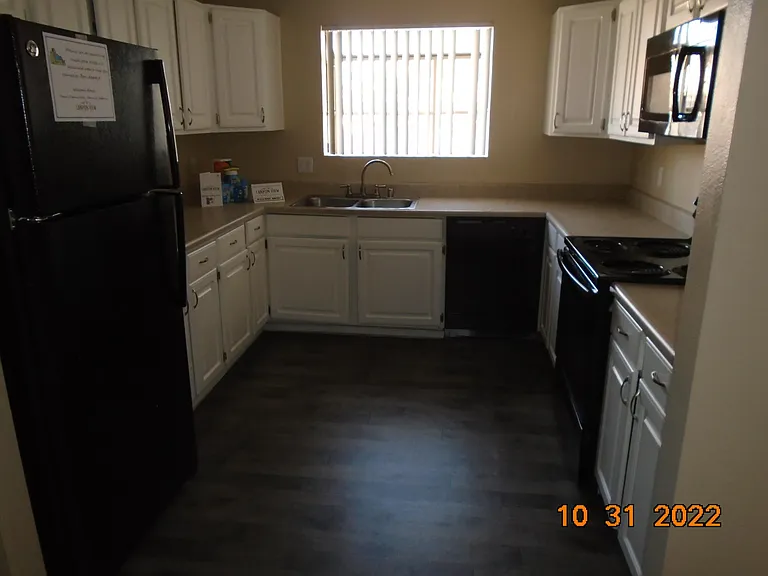 upstairs 2 bedroom - view of kitchen - has fridge, stove, dishwasher, microwave, and LED ceiling fixture