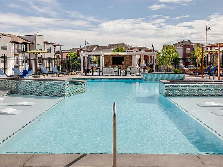 The Wright's resort-style pool features expansive lounge areas, in-water seating, and outdoor gathering spaces designed for relaxation and connection.