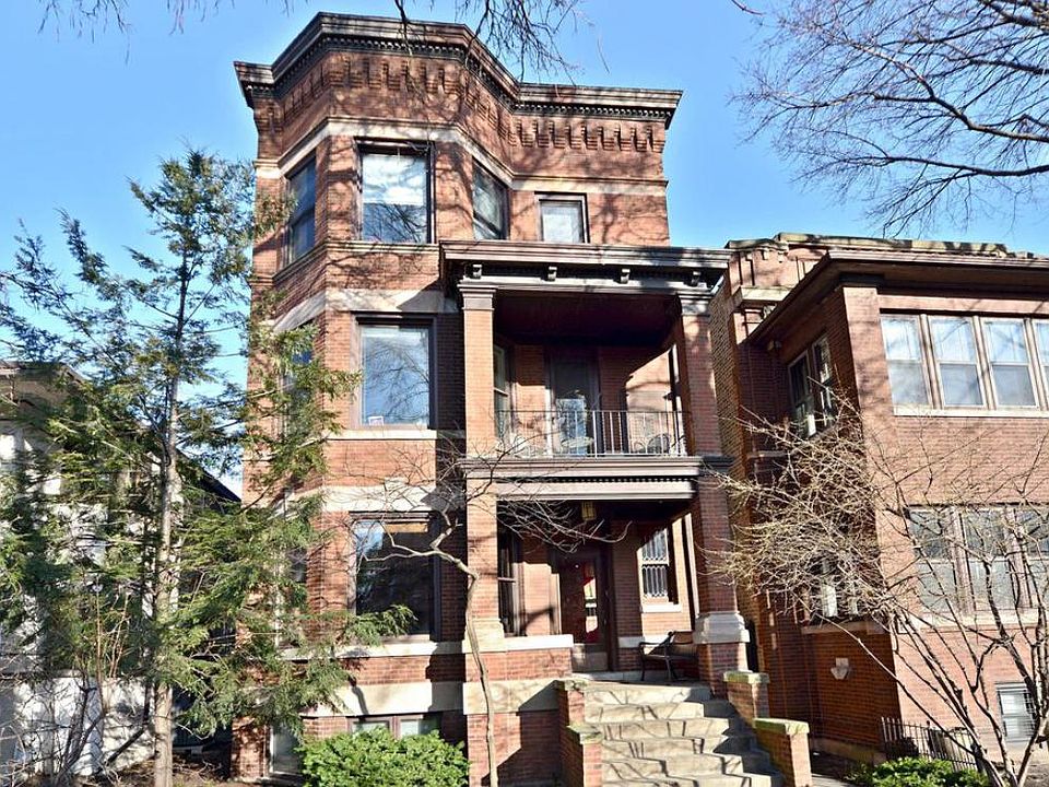 Unit occupies the first floor and lower level of a three-flat