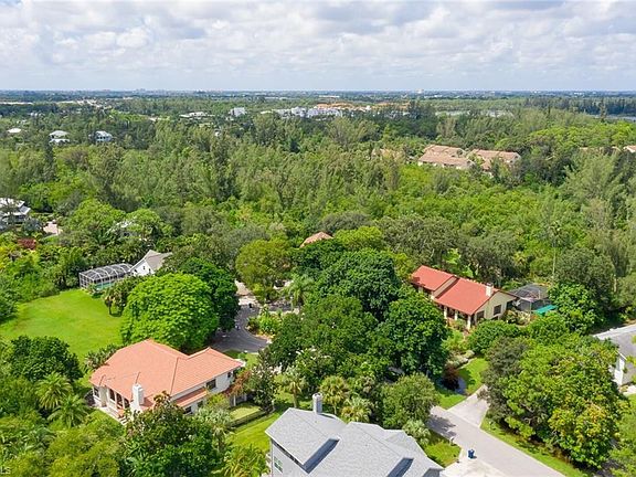 Aerial View Wooded Area and spare land.