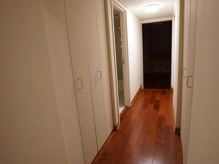 Tons of closet space in hallway from bedroom to bathroom