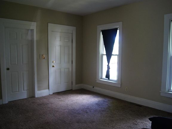 Living room opens to front porch