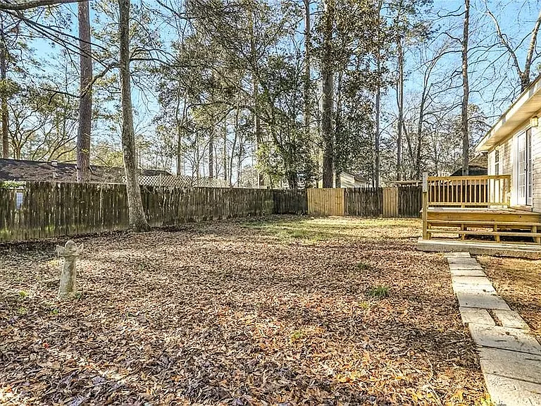 Backyard now has a concrete paver patio in the corner