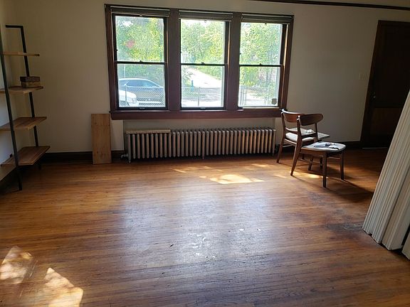 Spacious living room with large windows.