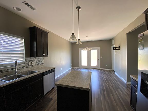 kitchen view of dining area and patio door