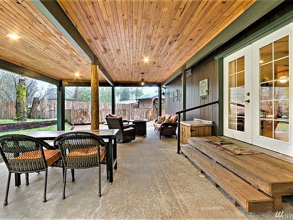French doors coming down to huge covered patio that has light sensor turning on lights with variable brightness adjustments!