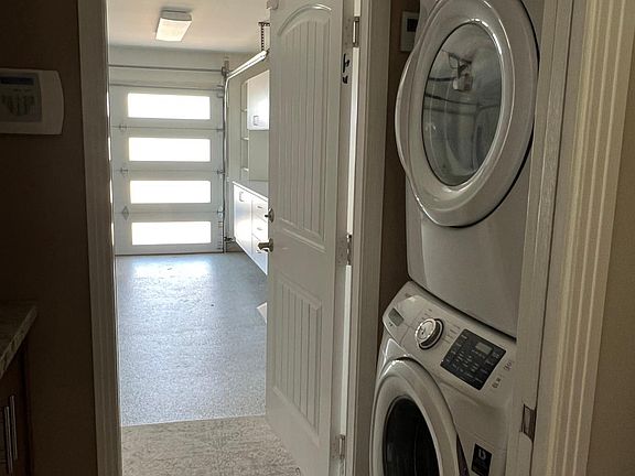 Washer and dryer area leading to garage