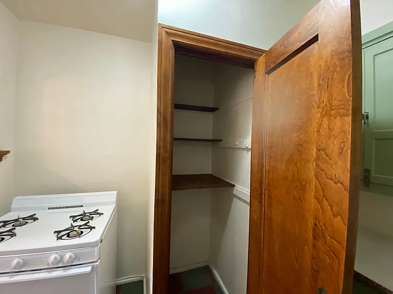 Spacious pantry closet with shelving utilizing the vertical space.