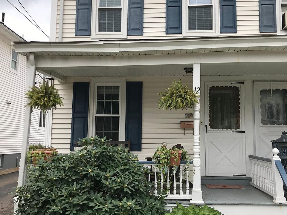 Front of house, unit is on end with one shared wall. Front