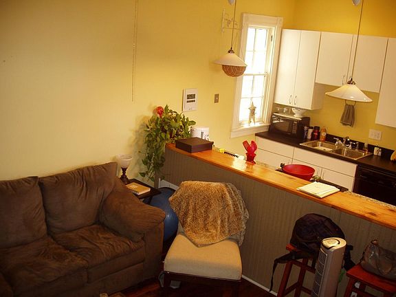 Den with kitchen