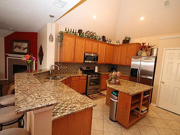 An over-sized breakfast bar opens up to the breakfast and living areas.