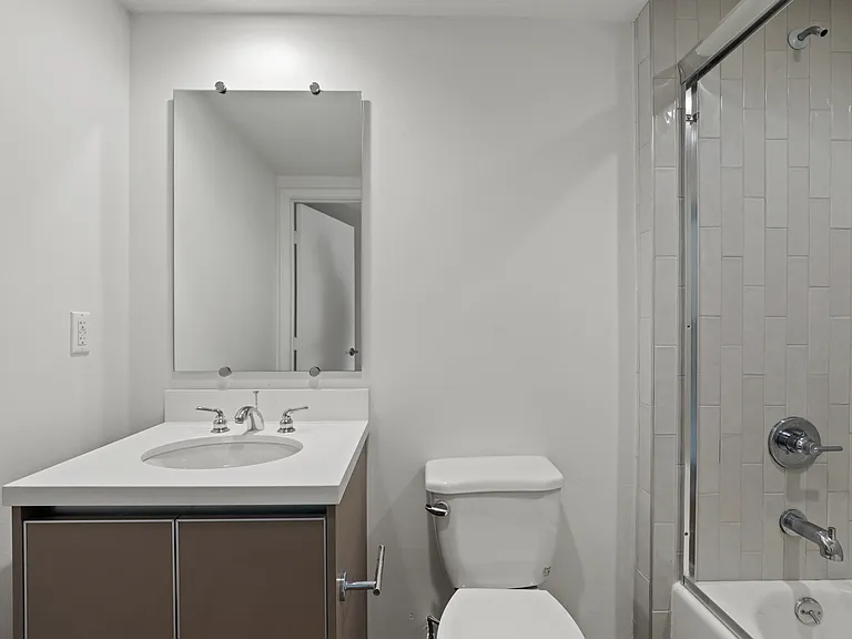 Bathroom with Shower Bath and Vanity Cabinet Storage