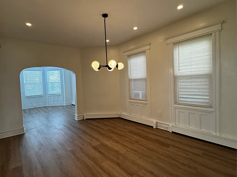 Dining Room (Actual Room): Bright, open dining area with modern lighting and an easy flow into the living room_perfect for everyday meals or entertaining guests