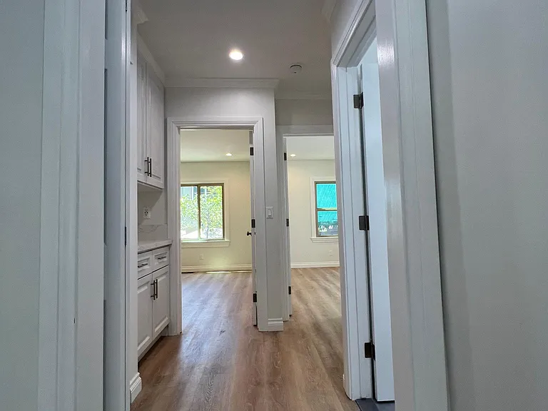Entering hallway going to Bathroom on the right.