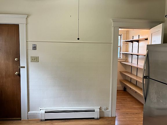 Kitchen showing pantry & back entry door
