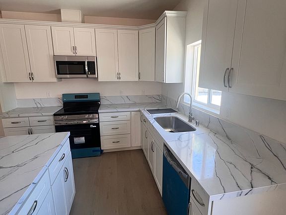 Good sized kitchen with new cabinets, counter tops, and stainless steel appliances.
