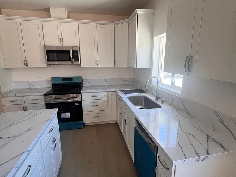 Good sized kitchen with new cabinets, counter tops, and stainless steel appliances.