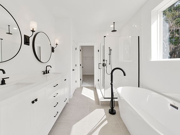 Primary bath with double vanity and matte black finishes