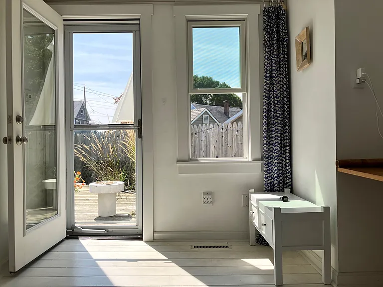 Furnished, sunny, private deck outside entrance/ living room
