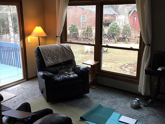 Living room with deck access to backyard