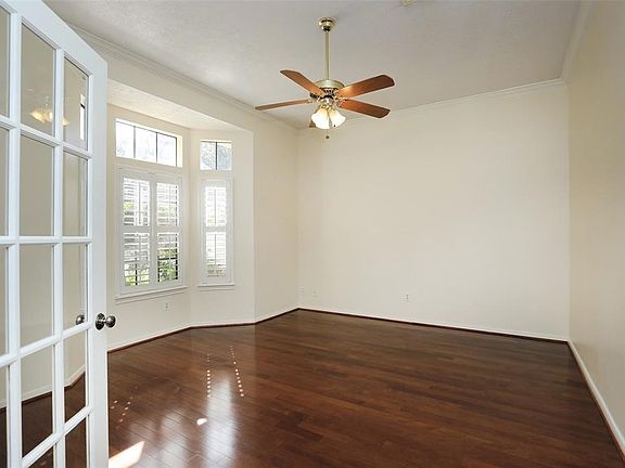 To the left of the entry is this wonderful study, home office or gameroom complete with french doors and bay windows. All of the front windows on the 1st & 2nd floors have plantation shutters.