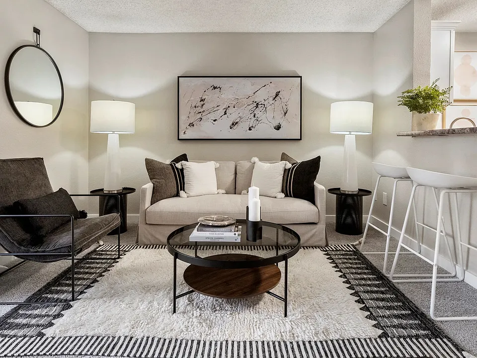 Featuring an open layout, neutral finishes, and convenient bar seating, this welcoming area is ideal for gathering with friends or enjoying a quiet evening at home.