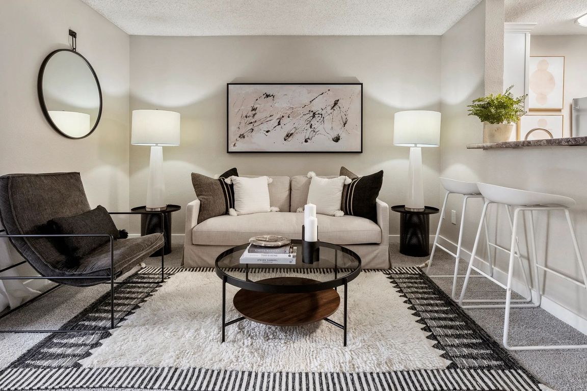 Dive into your spacious living room, where your plush carpeting option adds a touch of comfort. Your cozy oasis awaits!