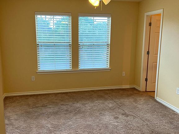 Master bedroom on 2nd floor with ceiling fan, full walk-in closet shown in other pictures, and full bathroom adjacent to one corner of the master bedroom.