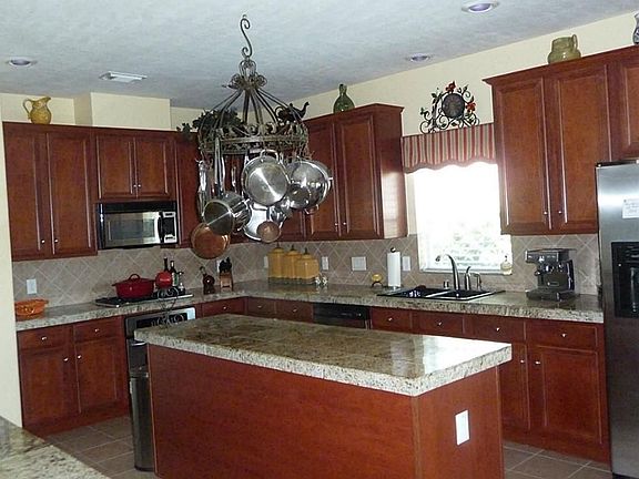 Gourmet kitchen lots of counter space and cabinets. Open floor plan to family room, great for entertaining.