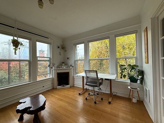 Living room view (can see church steeple view from bed when the french doors are open).