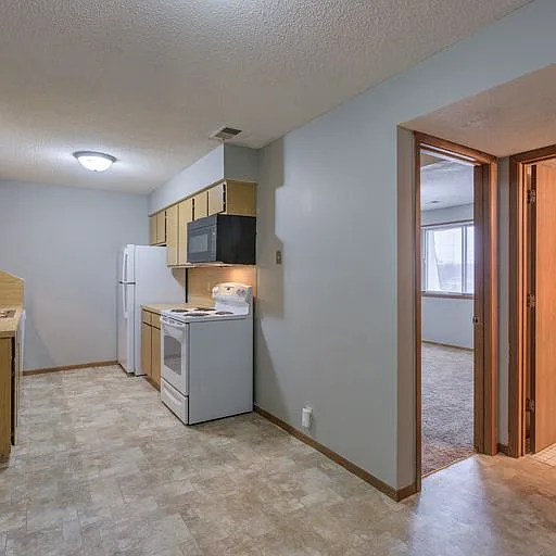 Kitchen with overhead lighting at 108 Blondo.