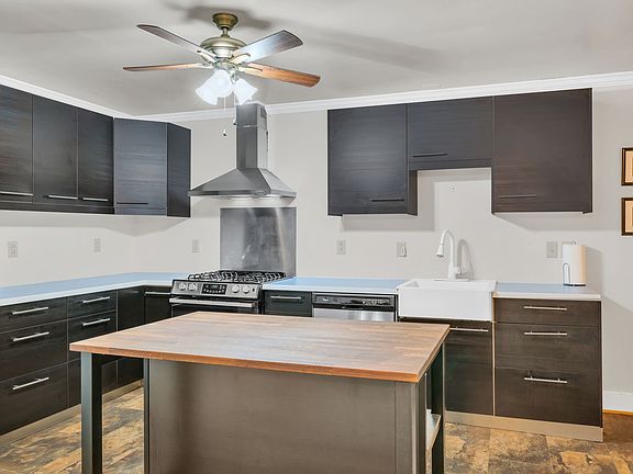 Kitchen features movable island