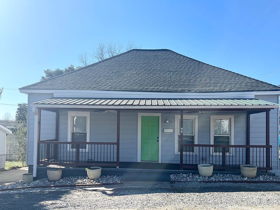 Spacious front porch with ceiling fans-great for enjoying your morning coffee. Double-sided driveway and now newly added gravel pad in front allows for plenty for off-street parking-truly a rare find in Cramerton!