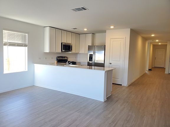 The U-shaped kitchen is fully equipped with brand-new appliances and ample cabinetry to make everyday meal preparation simple.
GE_ multicycle dishwasher, GE_ slidein gas range, GE_ microwave
Moen_ faucet and stainless steel sink, Solid surface countertop