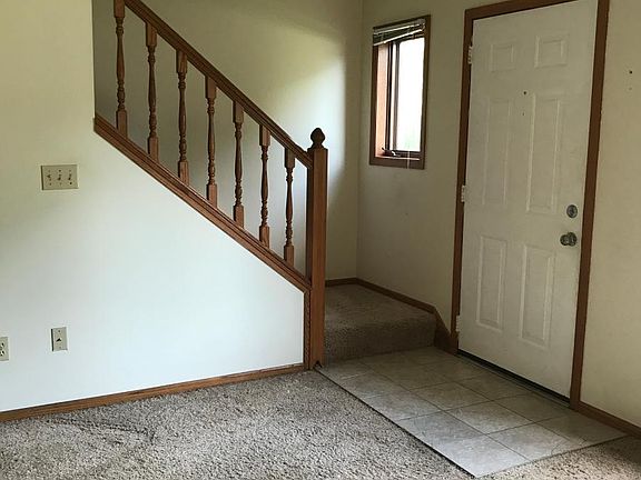 Stairs coming down from upper level to living room