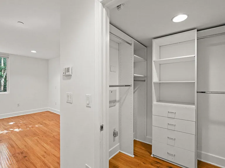 Bedroom with Walk-In Closet with Built-In Organizers