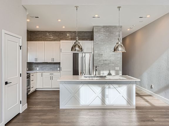 All new stainless steel appliances, dishwasher, fridge/freezer icemaker, gas stove with hood, oven, microwave, separate prep island for eating or dining in a separate space.