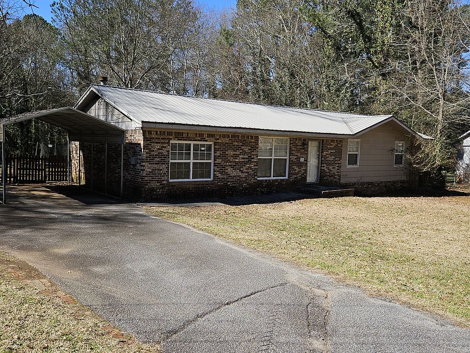 front of home with carport and ample parking