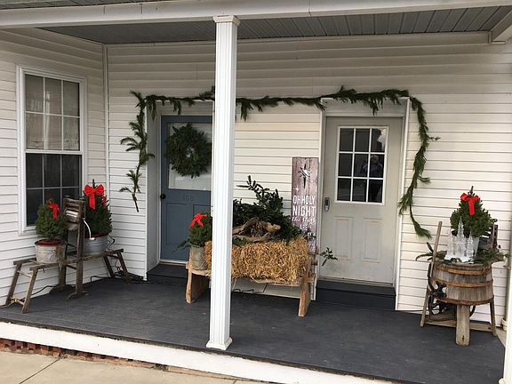 Front porch. Left door.