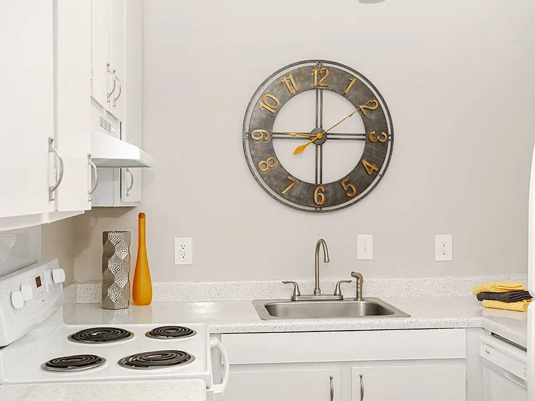 Kitchen with White Cabinets And Appliances