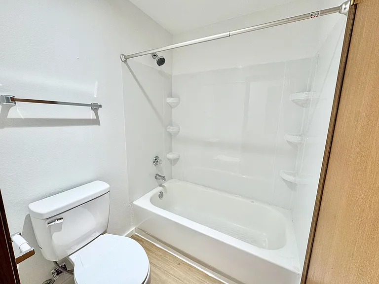 Separate bath area for tub/shower combo.