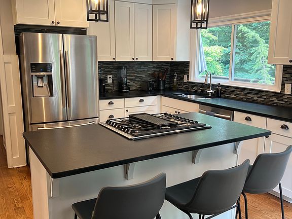 Kitchen with all stainless steel appliances.