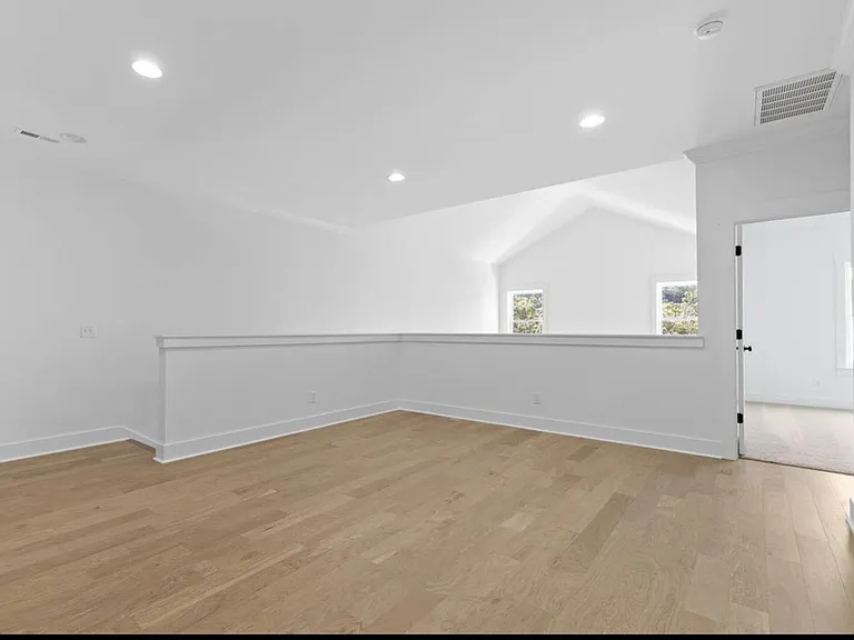 Seating area on upper level, ideal for home theatre.