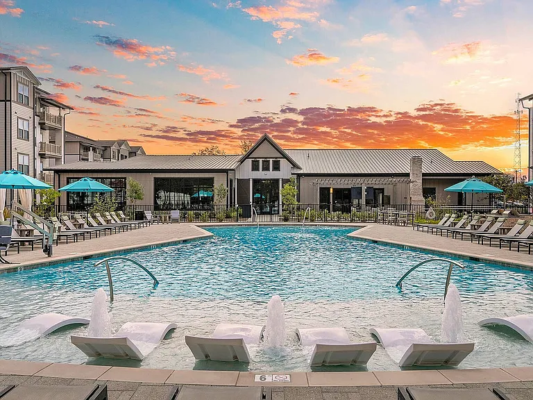 Experience tranquil evenings by the pool in this exquisite apartment community.