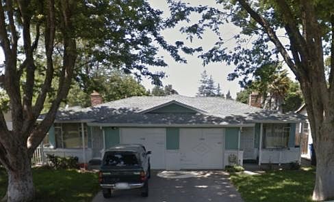Large Elm Trees Shade the Front