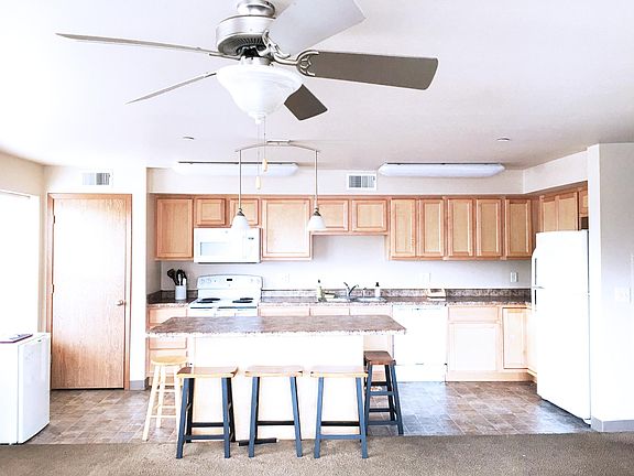 Large open concept kitchen with breakfast bar