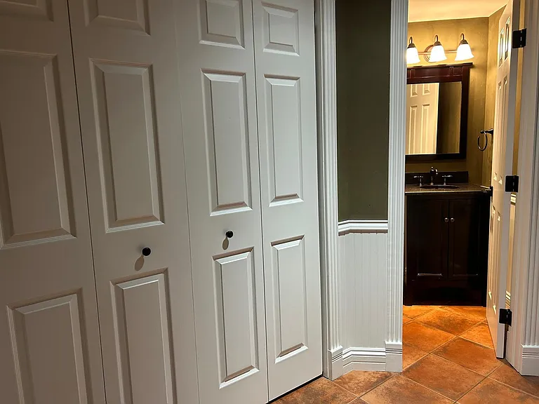 Entrance closet and half bathroom