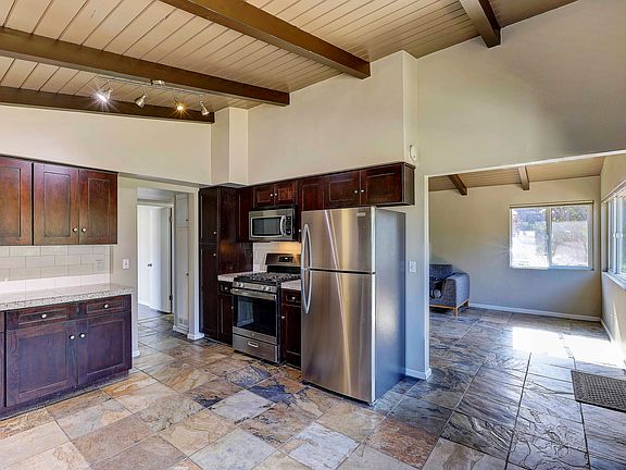 Kitchen looking into living room