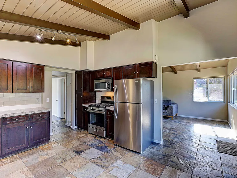 Kitchen looking into living room