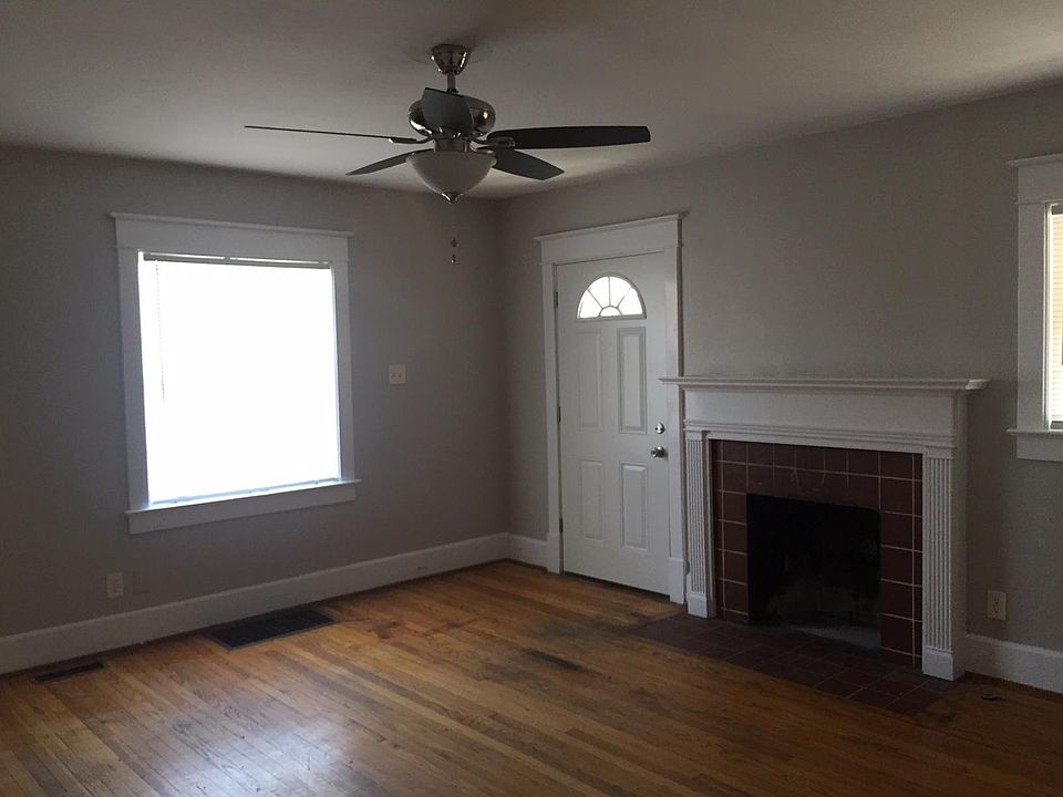 100 Dantzler Drive, very nice large living room with lots of natural light, hardwood floors, fireplace and great closet space.